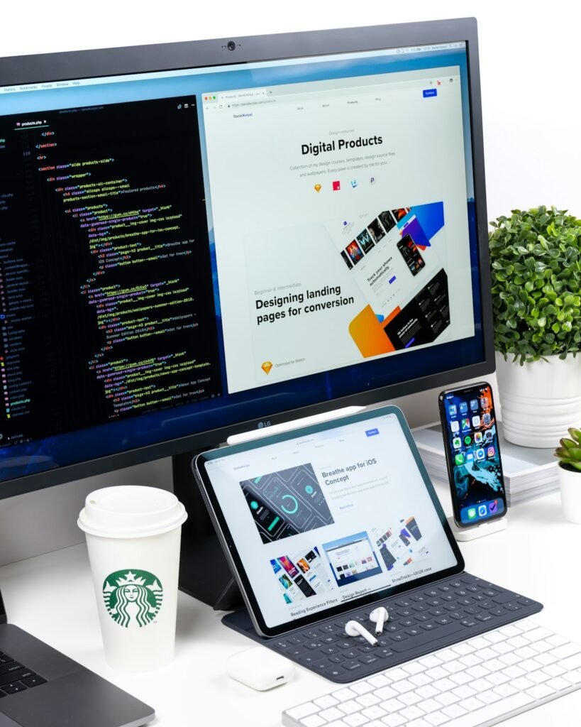Website designs on a monitor, tablet and phone
